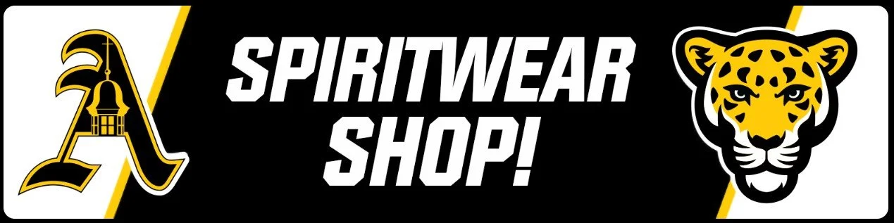 Banner for a spiritwear shop featuring a stylized letter 'A' with a lantern on top, the words 'Spiritwear Shop!' in bold white letters, and a yellow and black tiger head logo.