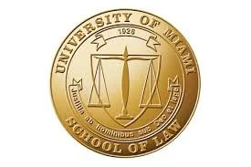 Close-up of a gold medallion with the text 'University of Maimi School of Law' and a scale symbol in the center.