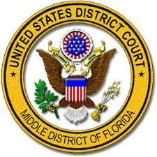 Emblem of the United States District Court, Middle District of Florida, featuring an eagle with a shield, olive branch, and arrows, surrounded by a yellow border with the district's name.