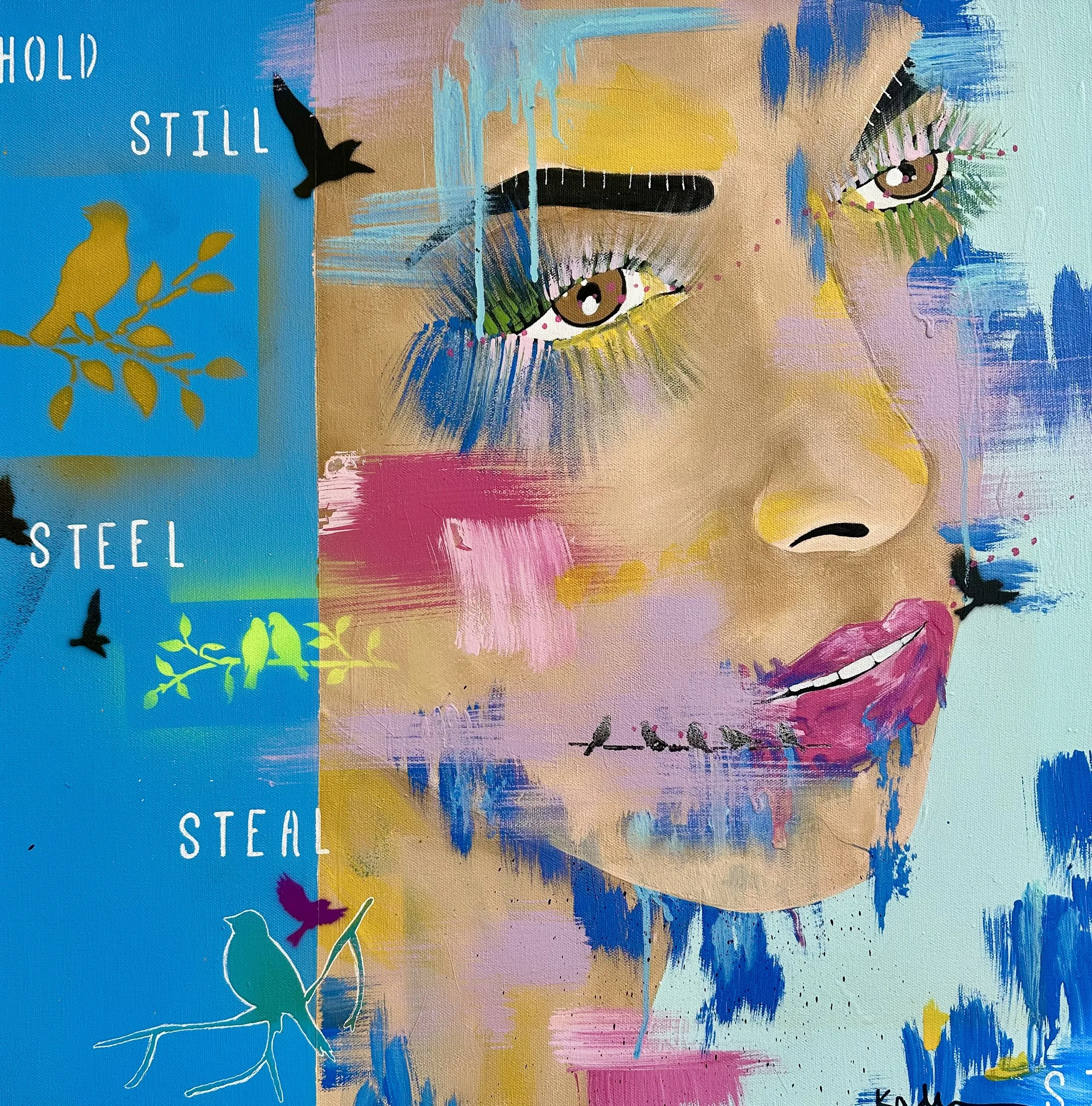Part of a colorful abstract painting of a woman's face with bright, expressive eyes, vibrant colors, and painted brushstrokes. The left side features a blue background with words and leaf illustrations, and the right side displays the woman’s face with makeup with pink lips.