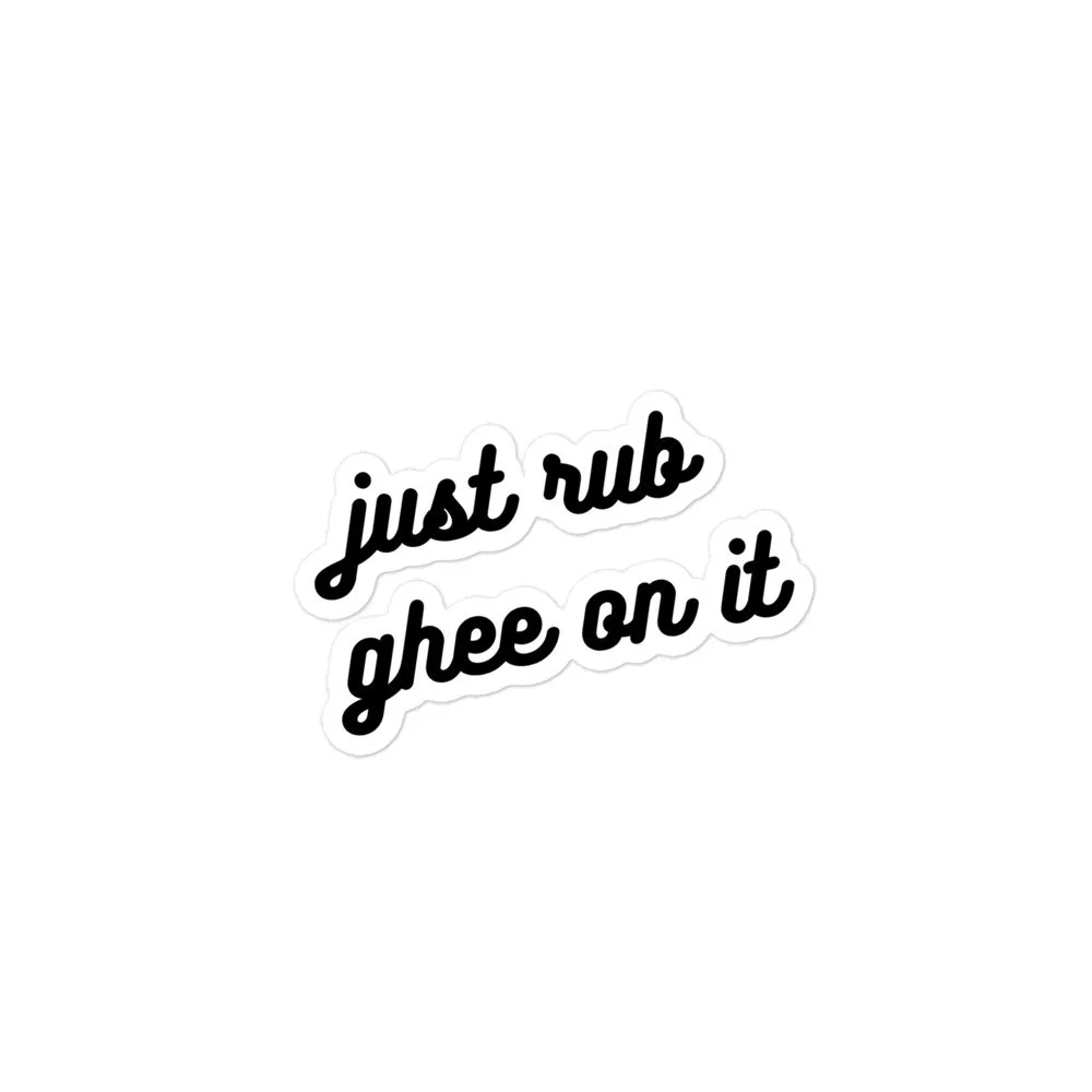 Sticker with the phrase "just rub ahee on it" in black cursive font on a white background.