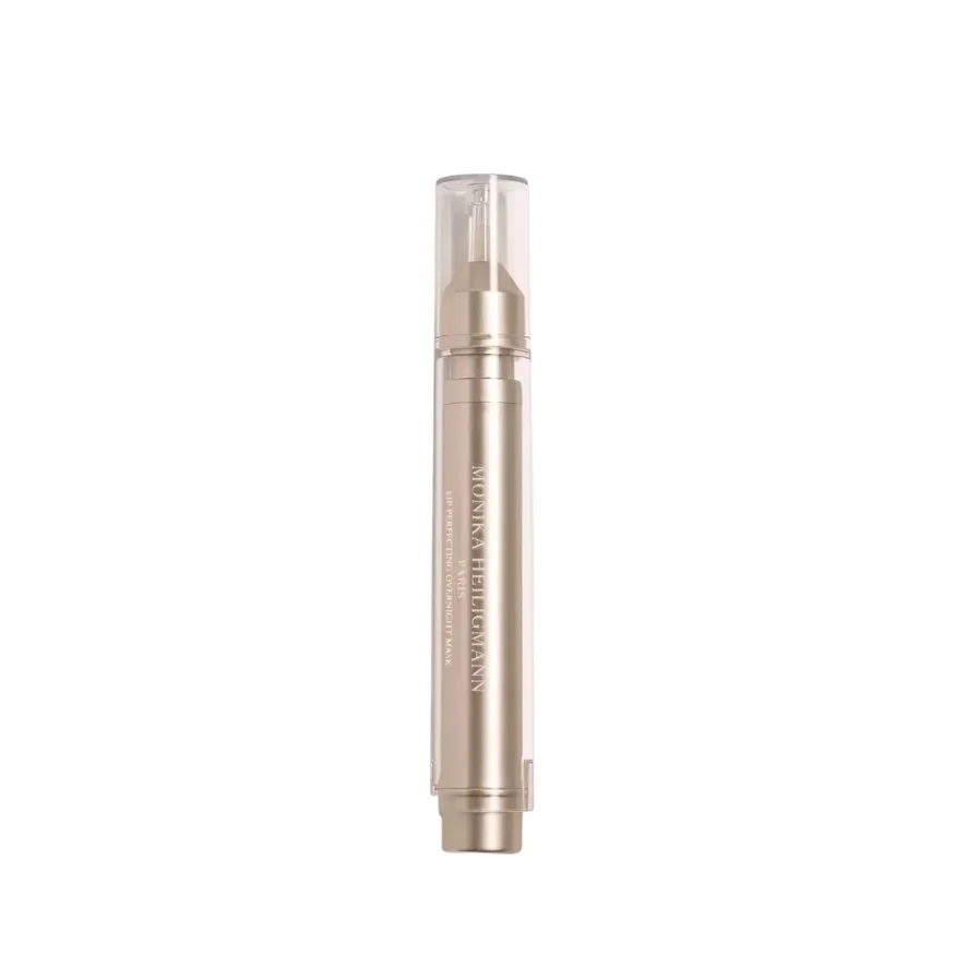 A cylindrical skincare or cosmetic product with a clear cap and metallic body, labeled 'Monia Heilmann'.