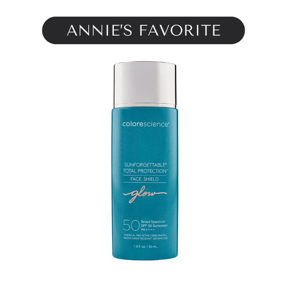 A blue bottle of Colorescience Sunforgettable Total Protection Face Shield with SPF 50 is shown, with black label on top reading 'Annie's Favorite'