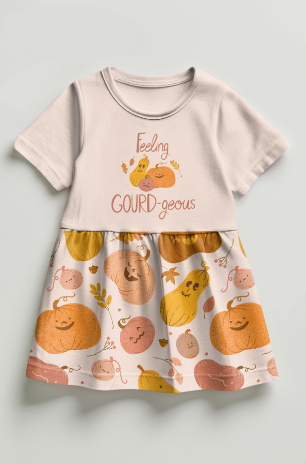A children's dress with a top that says "Feeling GOURD-geous" and features cute cartoon pumpkins and gourds, with a patterned skirt decorated with happy pumpkin and gourd illustrations.