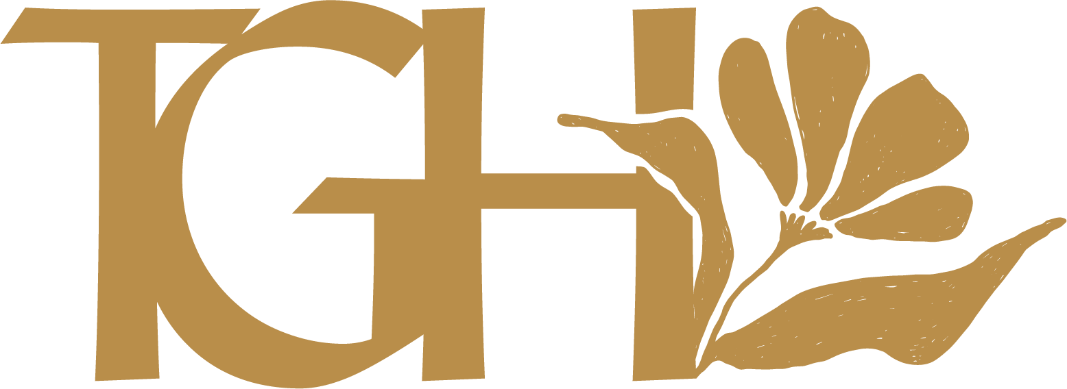 Stylized gold logo with the letters T and G and H and a flower design for garden and landscaping brand in Calgary