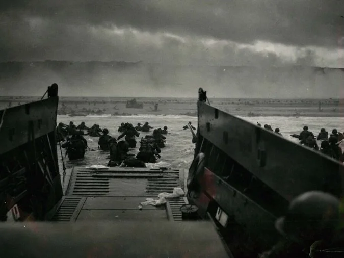 Put yourself in this photo. Look at this for 60 seconds. Really take it in. 

What would you feel in this moment 82 years ago? 

Would you freeze as bullets whistle by your head? Would you walk forward to the horrifying sights and sounds in front of 
