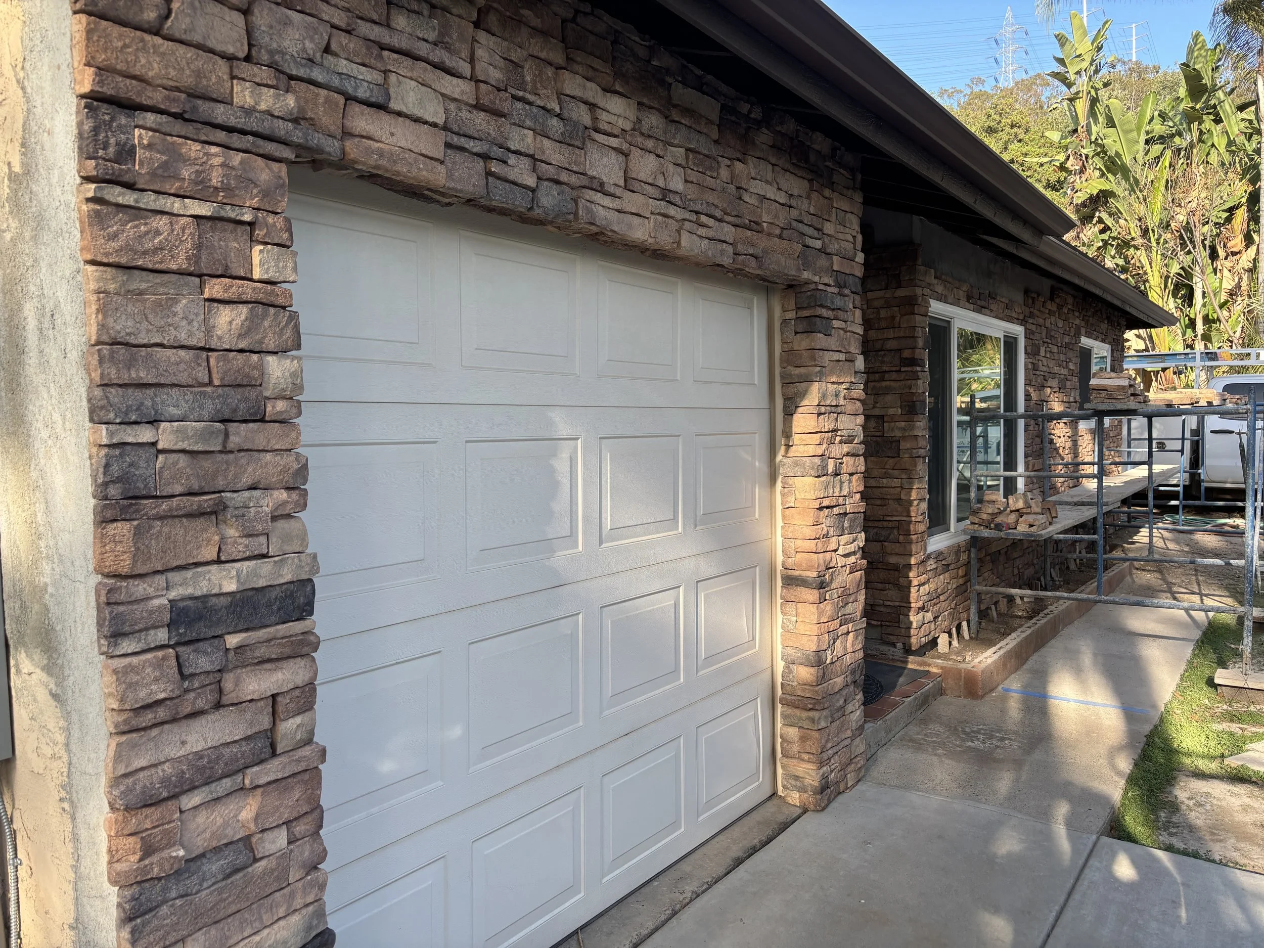 Custom Stone Veneer Wall in San Diego, CA featuring stone veneer around a garage