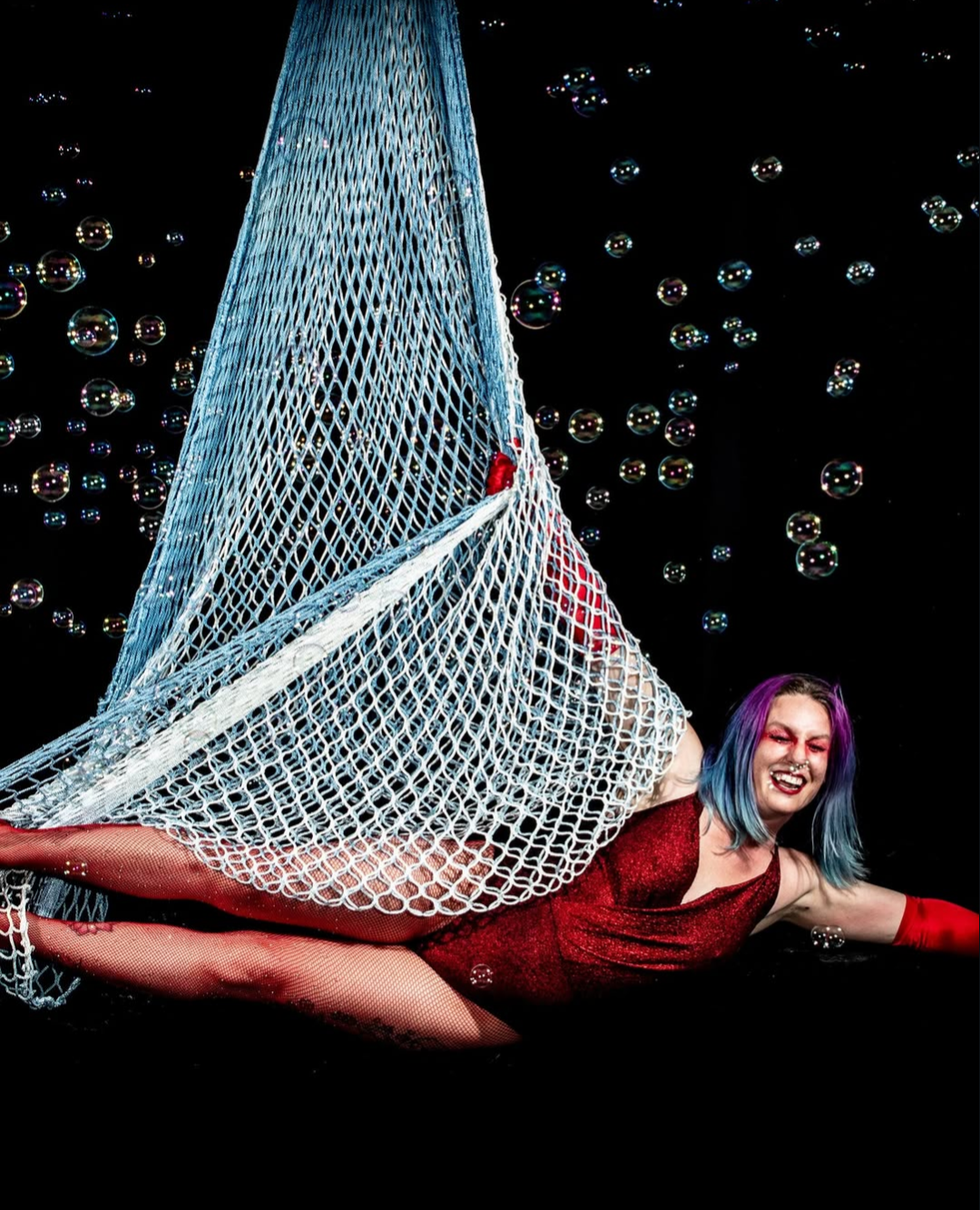 SweryTalePrincess in a white net with bubbles in the background