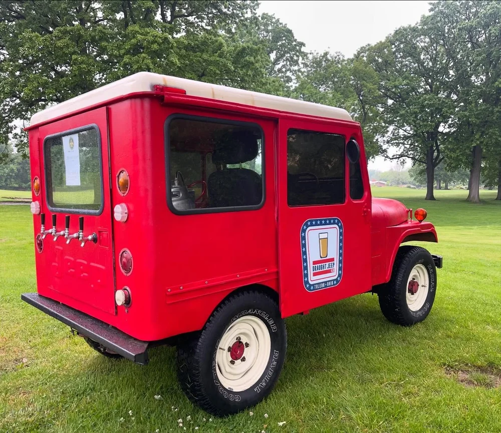 Draught Jeep 419, a red 1972 postal Jeep with taps on the back