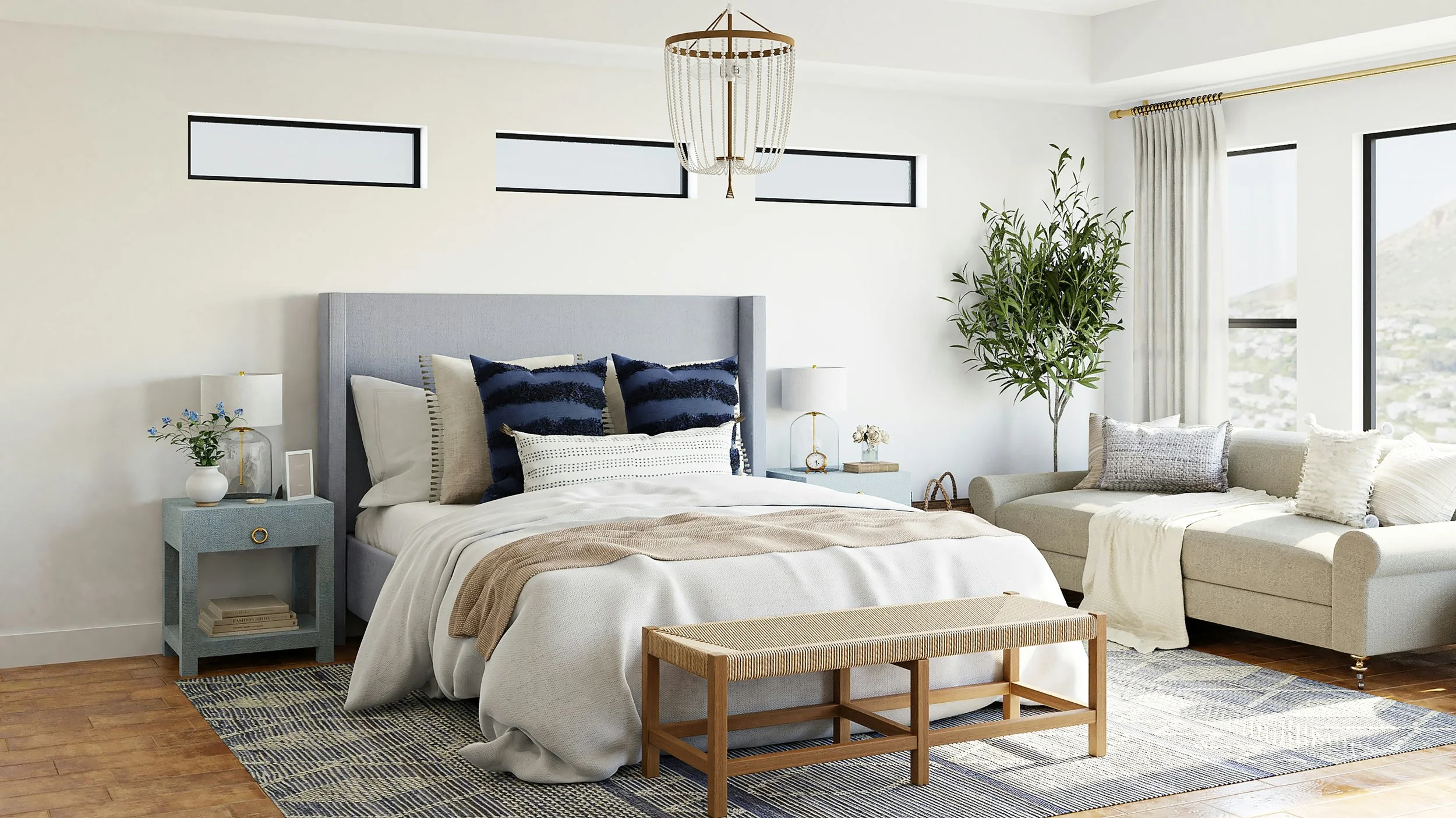 Bright and airy bedroom with a large bed, nightstands, and a seating area near windows, decorated in neutral tones with blue and green accents.