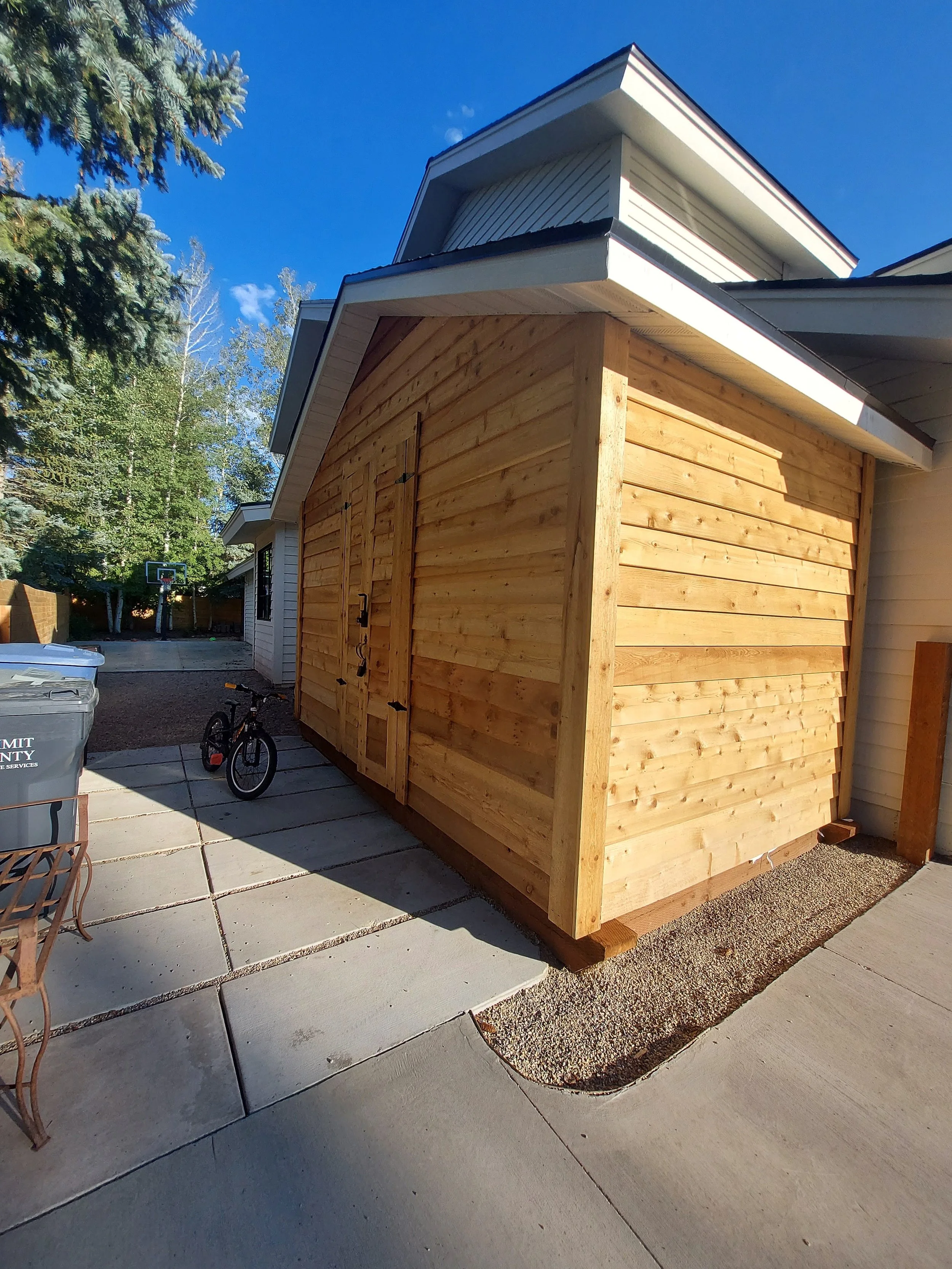 Cedar wood shed before staining to match the house