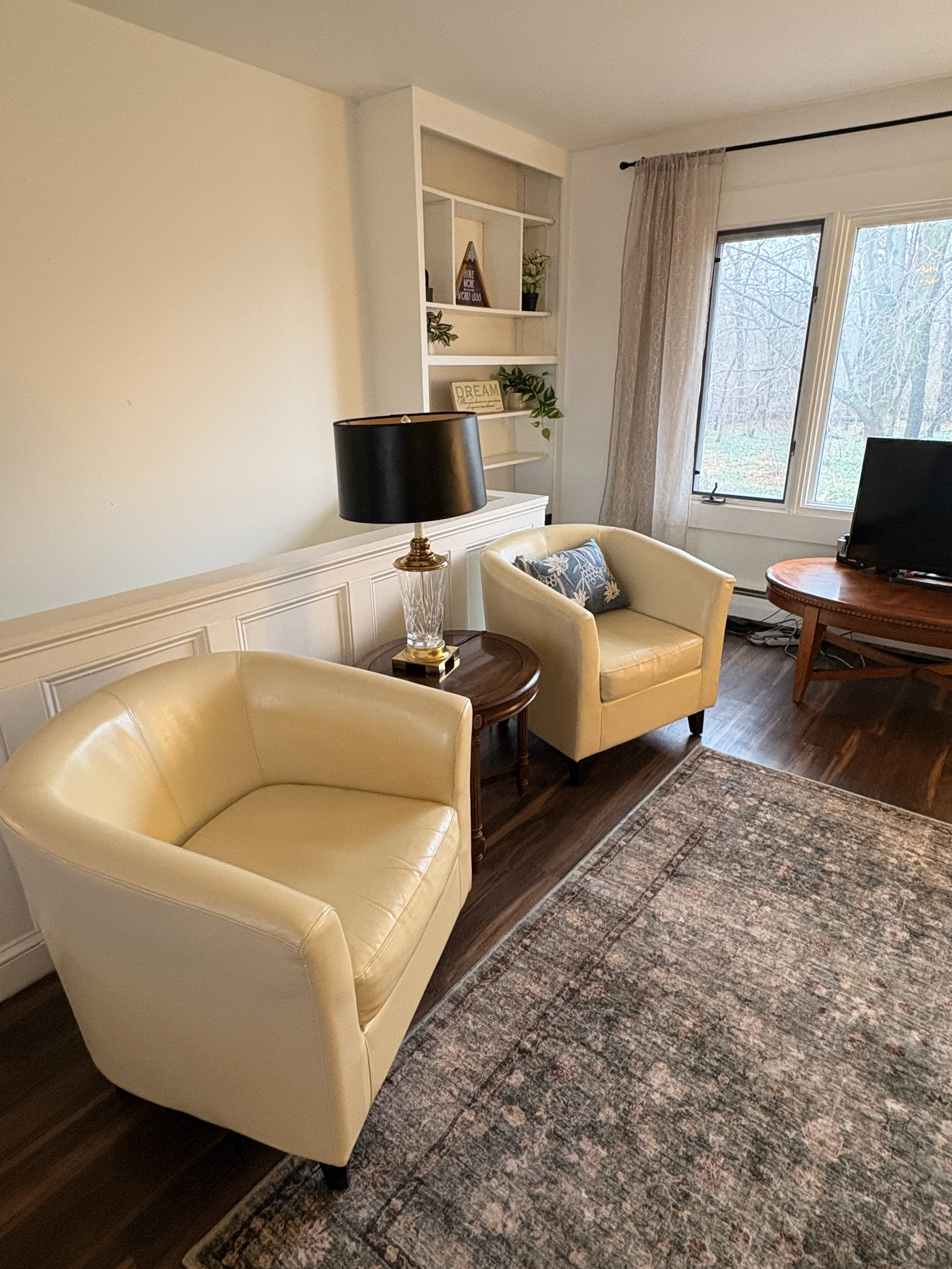  co-living living area with tan chairs 
