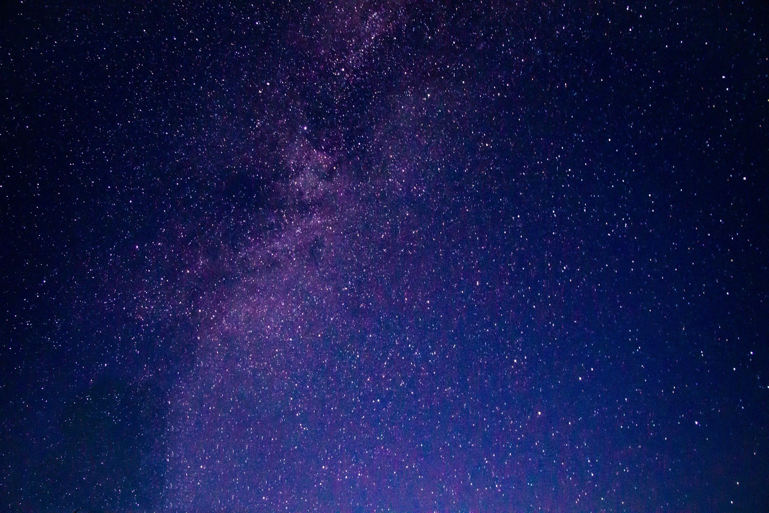 A clear night sky filled with numerous stars and a faint view of the Milky Way galaxy. Describing QHHT possible discoveries.
