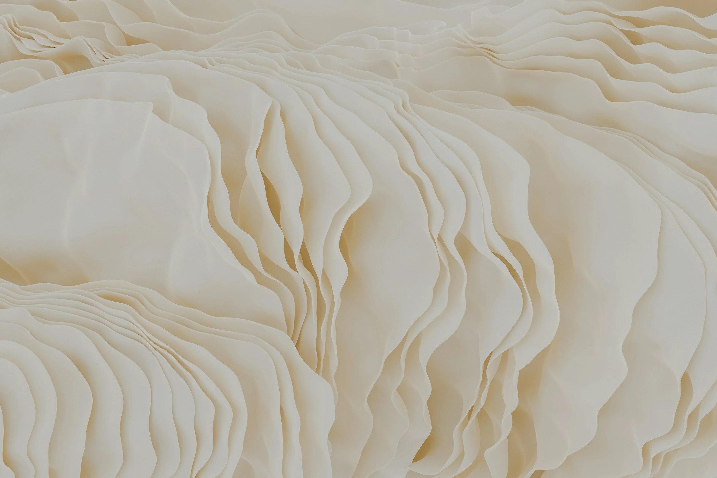 Close-up of cream-colored paper with scalloped, layered, wavy edges, creating a textured, abstract pattern. Meaning behind is that everyone is unique and has their experience, story.