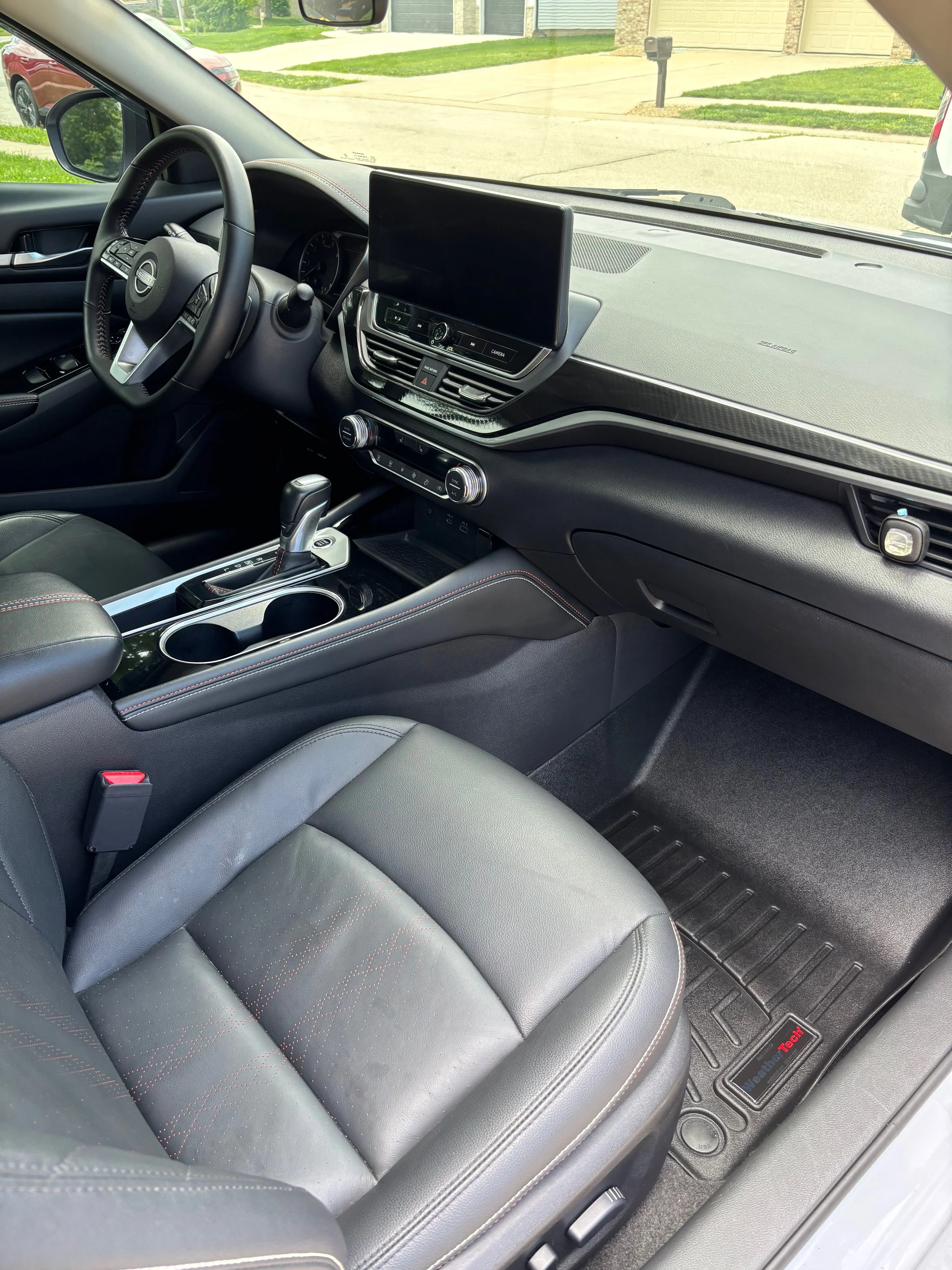 Immaculate black leather driver seat steering wheel dashboard and carpet floor Springfield IL