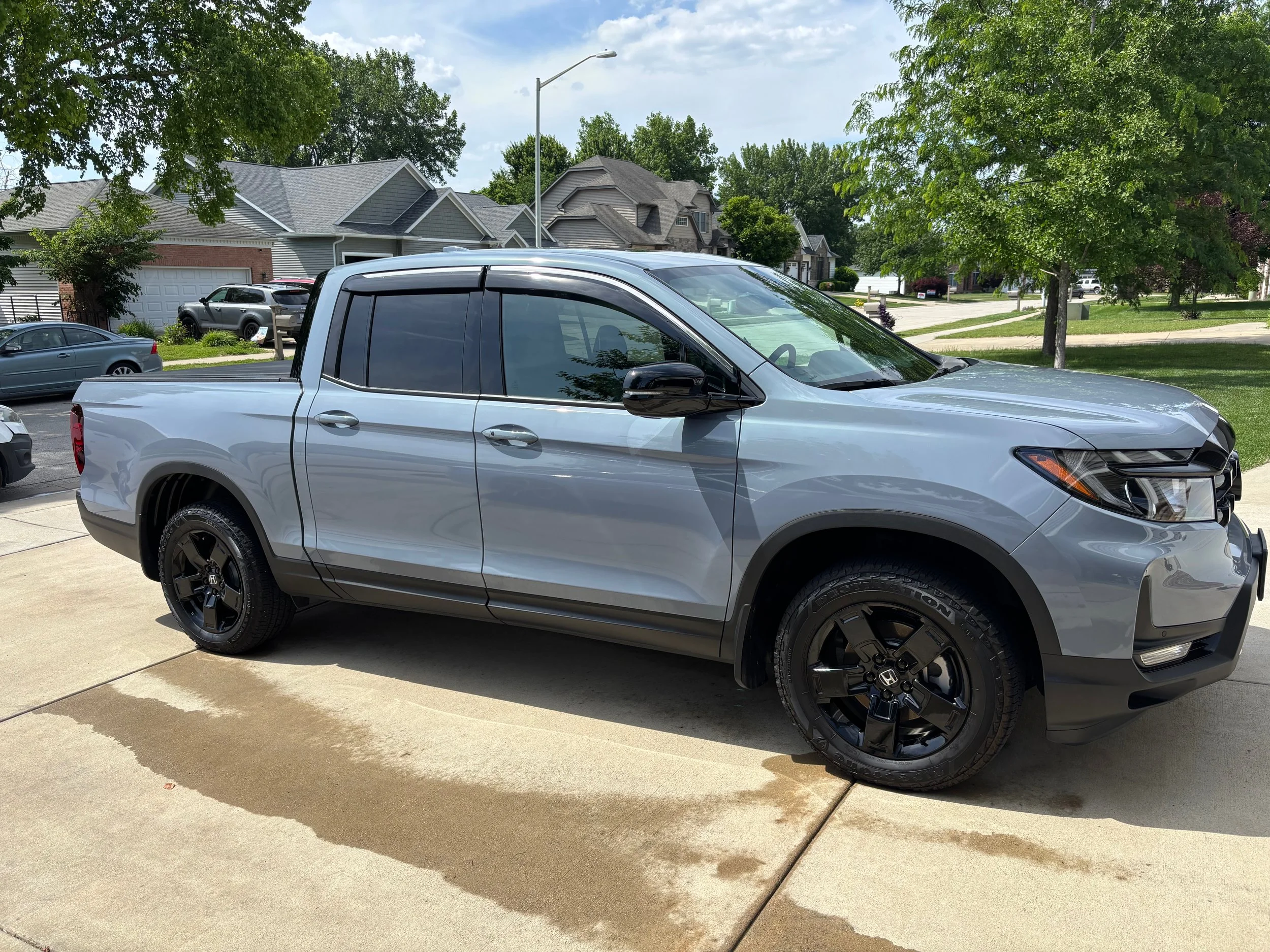 Mobile car detailing exterior wash and black wheel treatment on Honda Ridgeline truck Springfield IL