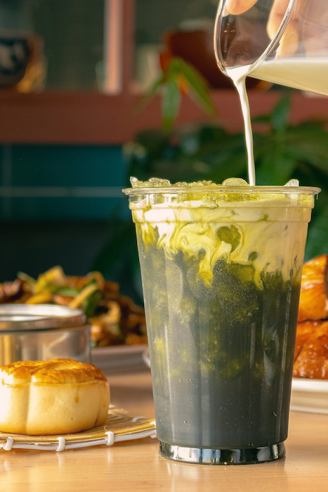 Kai Kai BBQ green Thai tea drink being poured