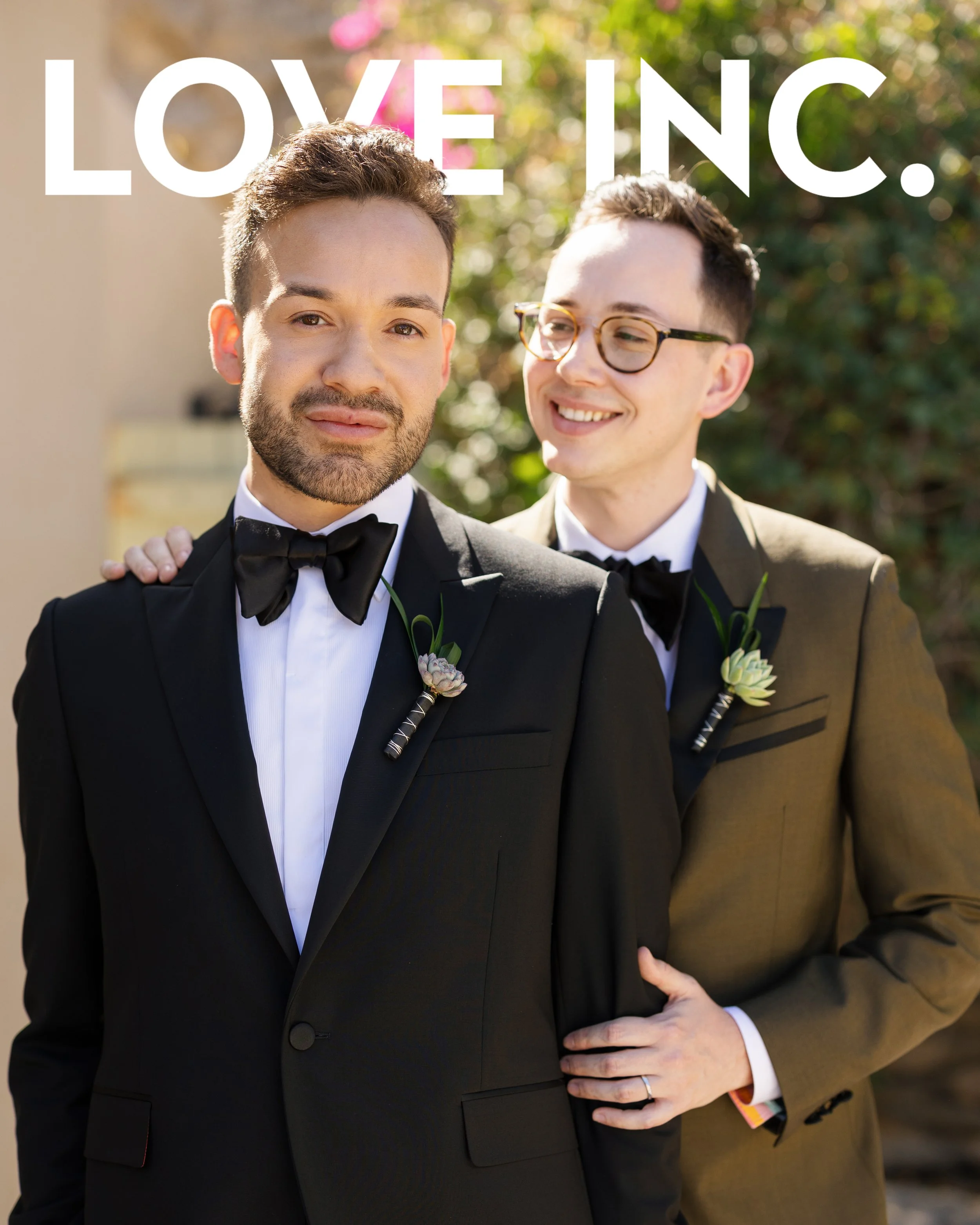 Two men in tuxedos smiling outdoors with the words "LOVE INC." overlayed at the top.