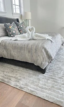 Hotel-quality bed presentation with towel swans