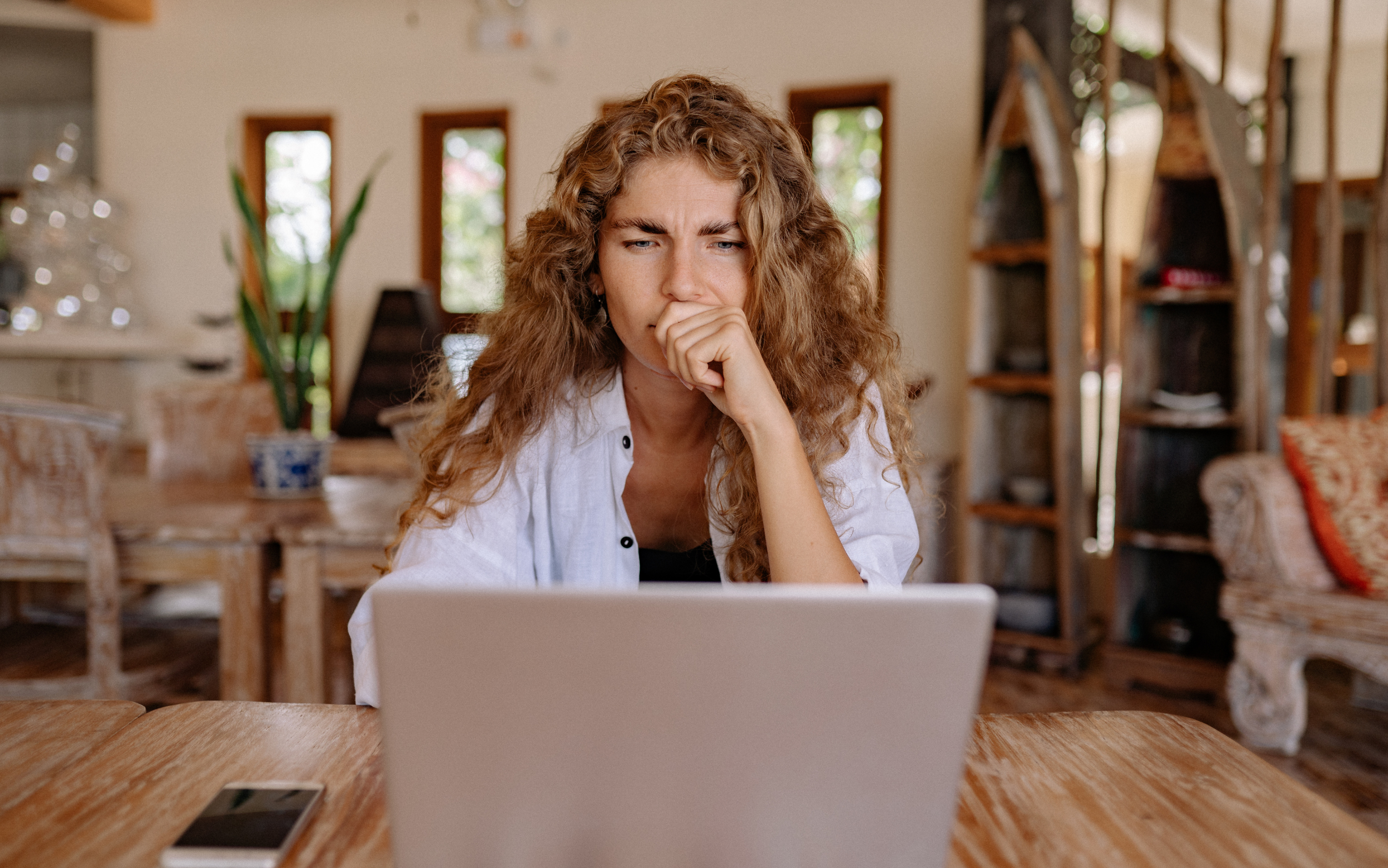 Lady looking at laptop screen.