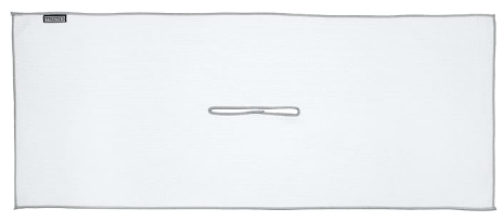 A safety pin on a closed white envelope or cardboard piece.