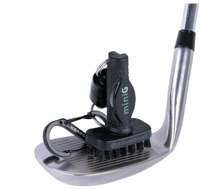 Mini golf putter with a brush and ball marker