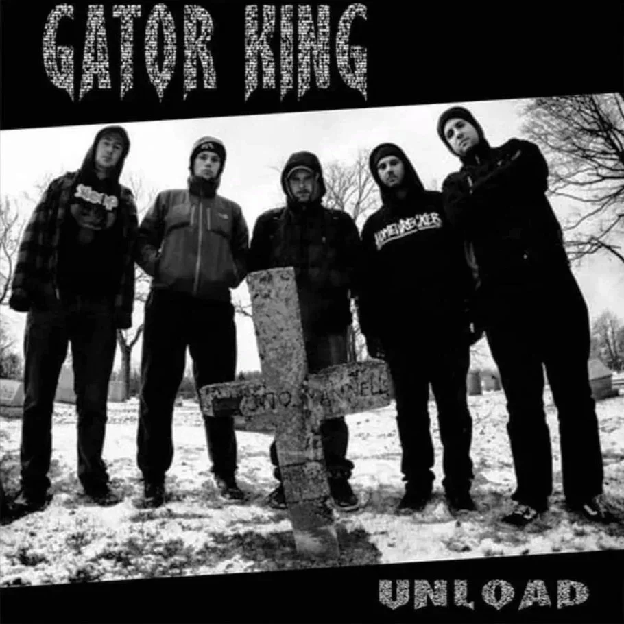 Black and white photo of five young men standing outdoors in winter, with a grave marker in front of them. The top of the image features the text 'GATOR KINGS' in a distressed font, and the bottom has the text 'UPLOAD' in matching style.