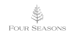 Logo for Four Seasons featuring a stylized tree with the words 'Four Seasons' underneath.