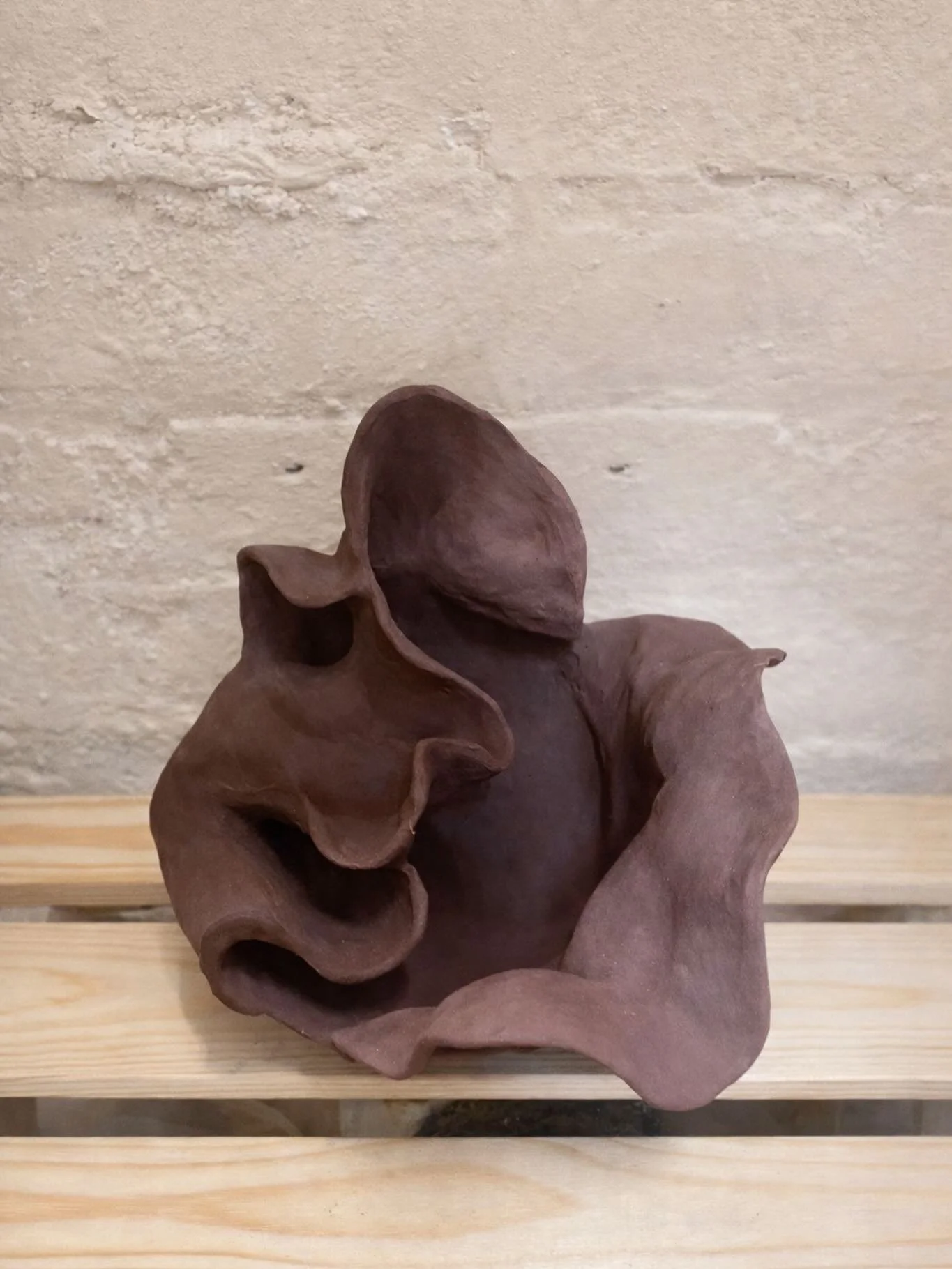 I&rsquo;ve sculpted a few of these types of pieces, starting from a dome form and evolving into a gradually flourishing soul.

Right now, she is incubating as greenware, almost dry to the bone, almost ready to fire. 

I can&rsquo;t wait to see her ea