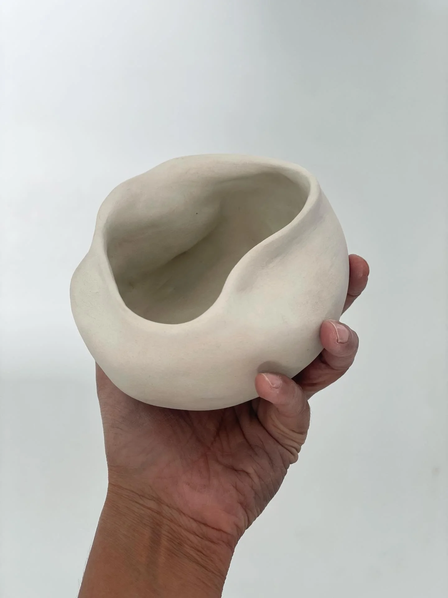 She feels found rather than made.
As though I picked it up at the foot of the chalk cliffs from the Marina,
a softened boulder, shaped by sea and time.

It holds something of both:
stone and water,
cave and vessel,
land meeting ocean.
 
A local story