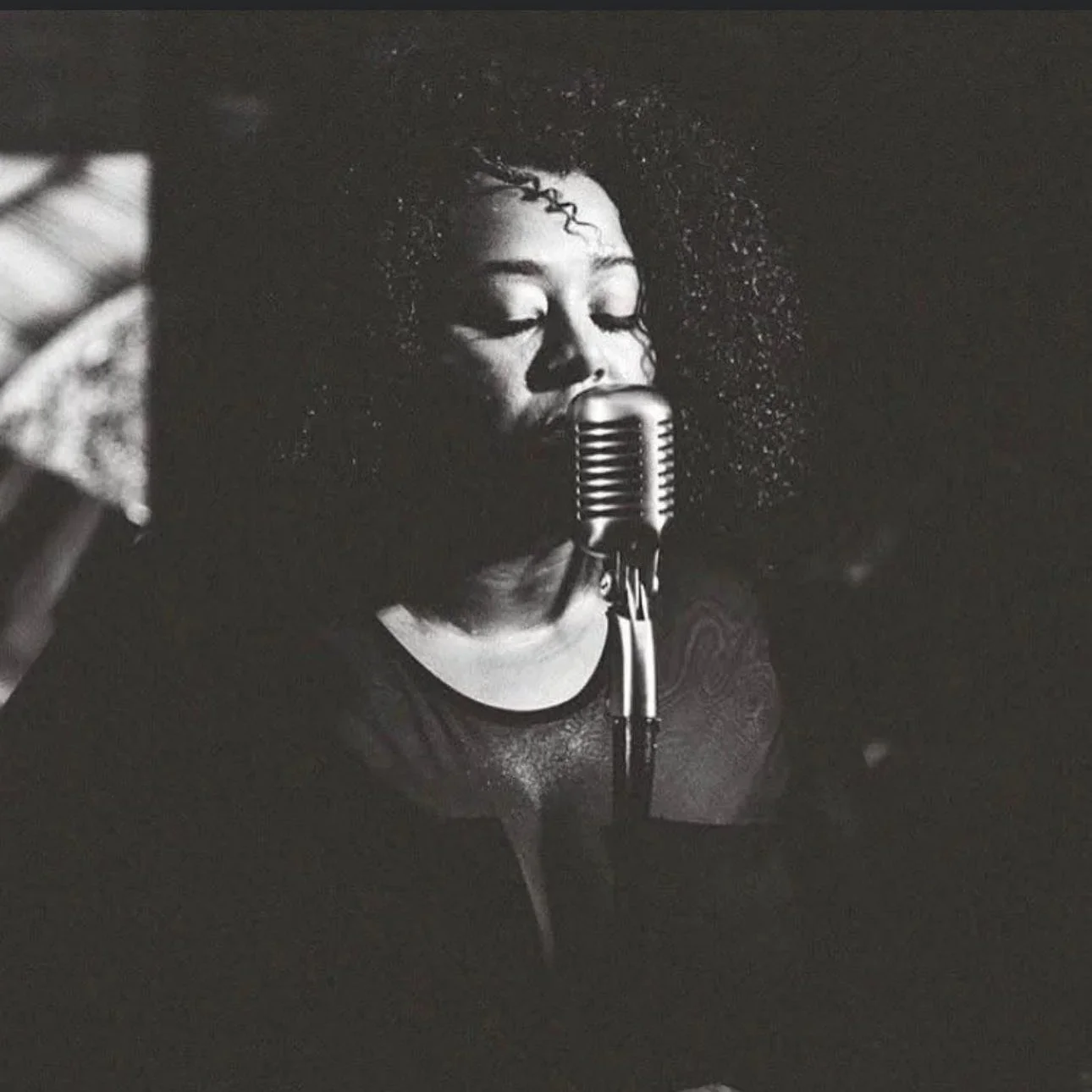 Geometric drawing of an outline square with sections divided by vertical, horizontal, and diagonal lines.