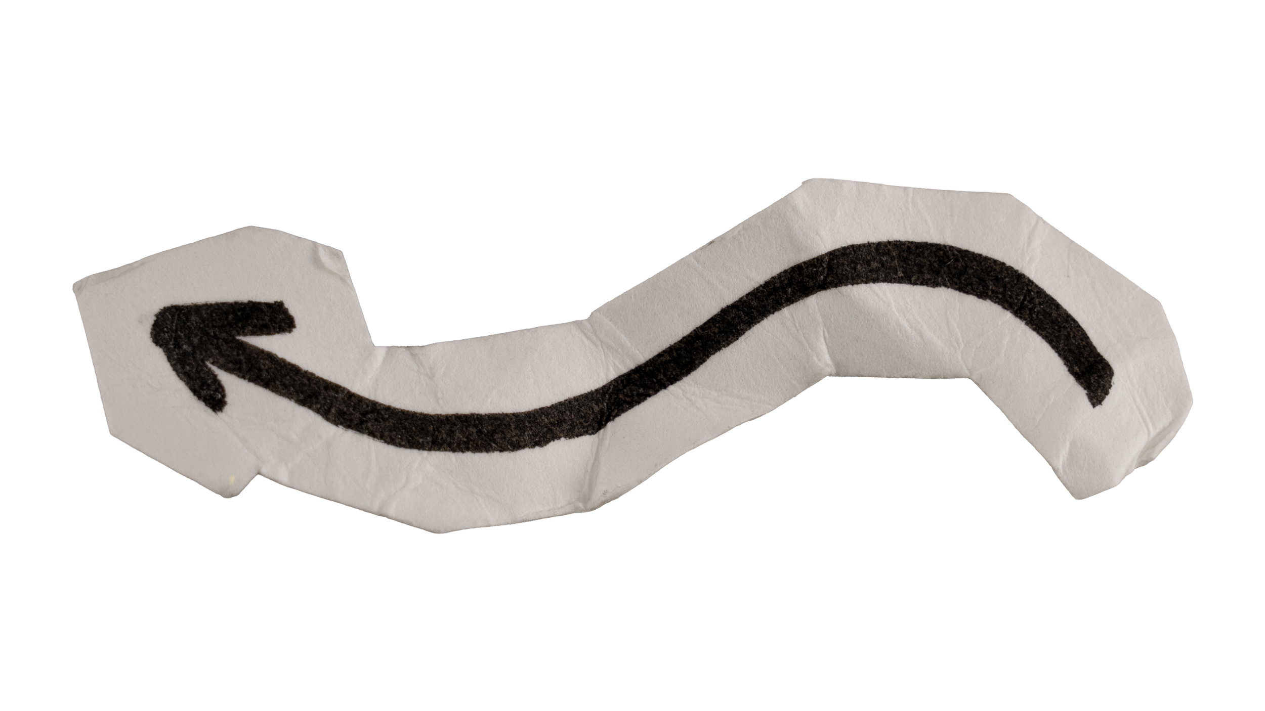 Crumpled piece of paper with a black arrow drawn on it, indicating a curved left turn.