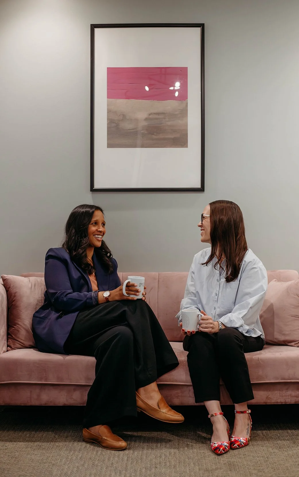 Dr. Shawna Jacob and Dr. Audrey Greene sititng in their office in Cincinnati.