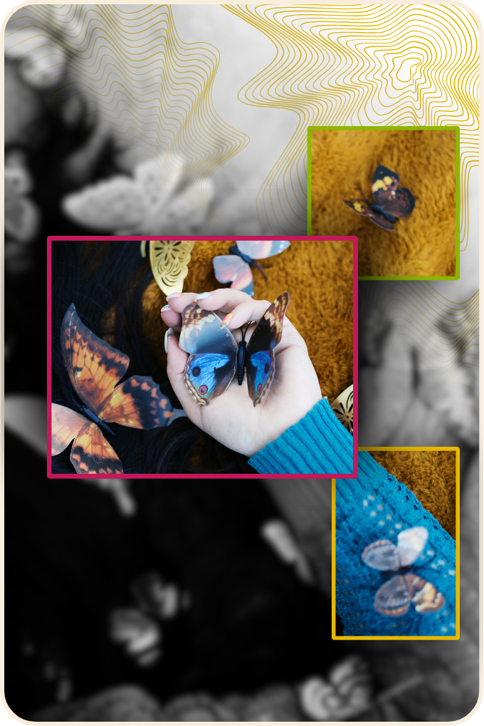 Person holding blue morpho butterfly with other butterflies on person's hand and blue sleeve, surrounded by other butterflies on yellow and black background.