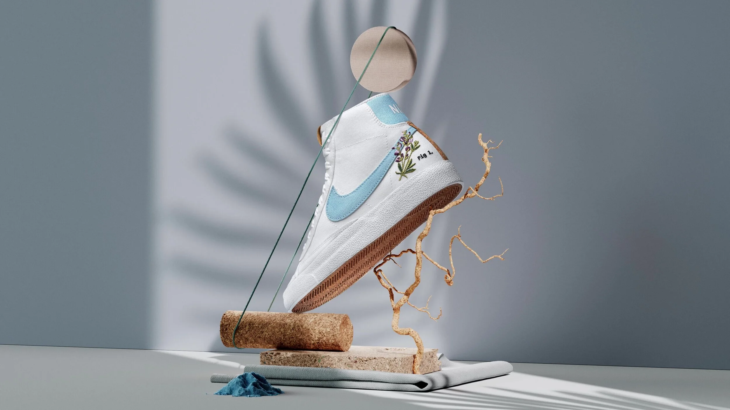 nike shoe in front of palm tree shadow