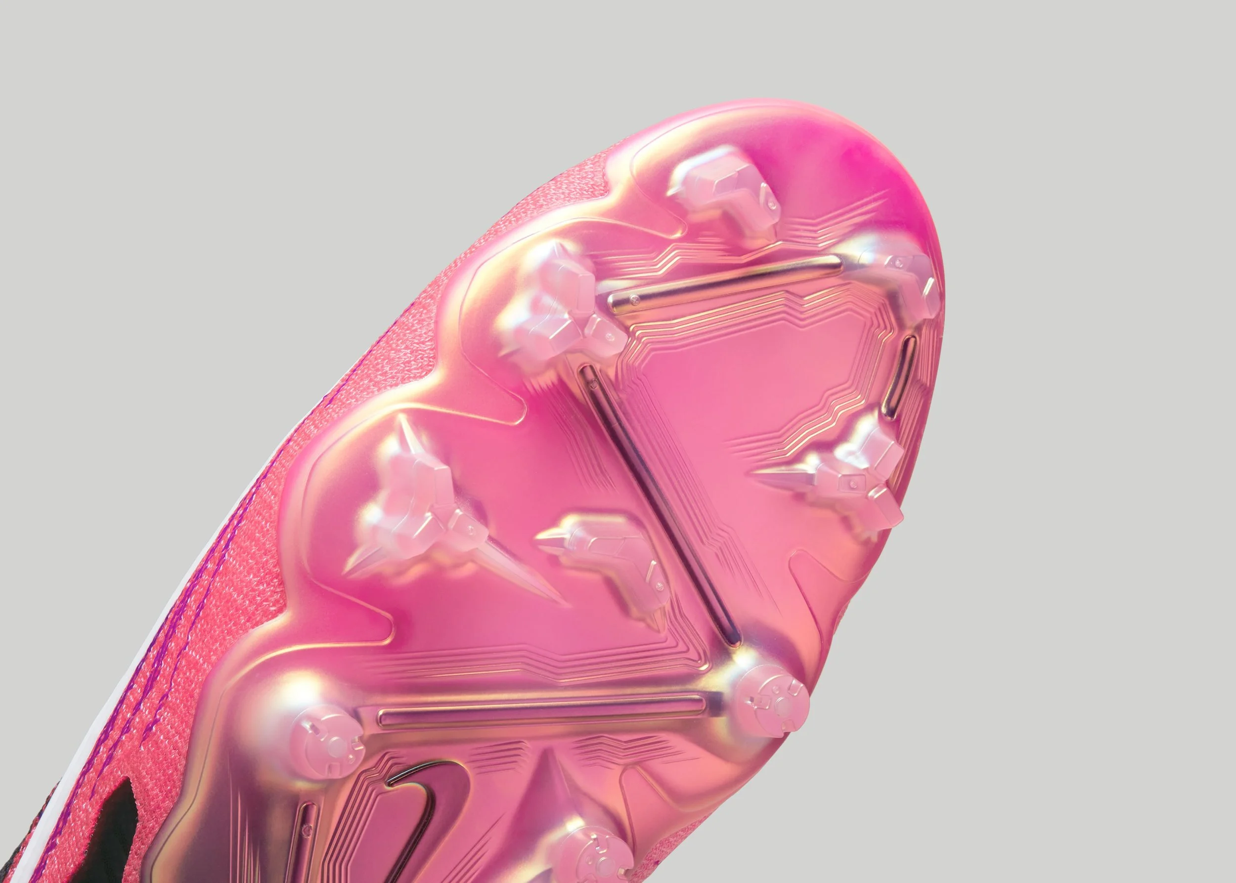 bottom of black and pink nike cleat