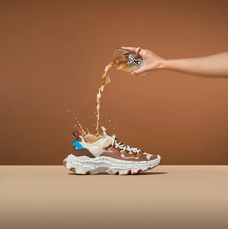 coffee being poured into brown sneaker