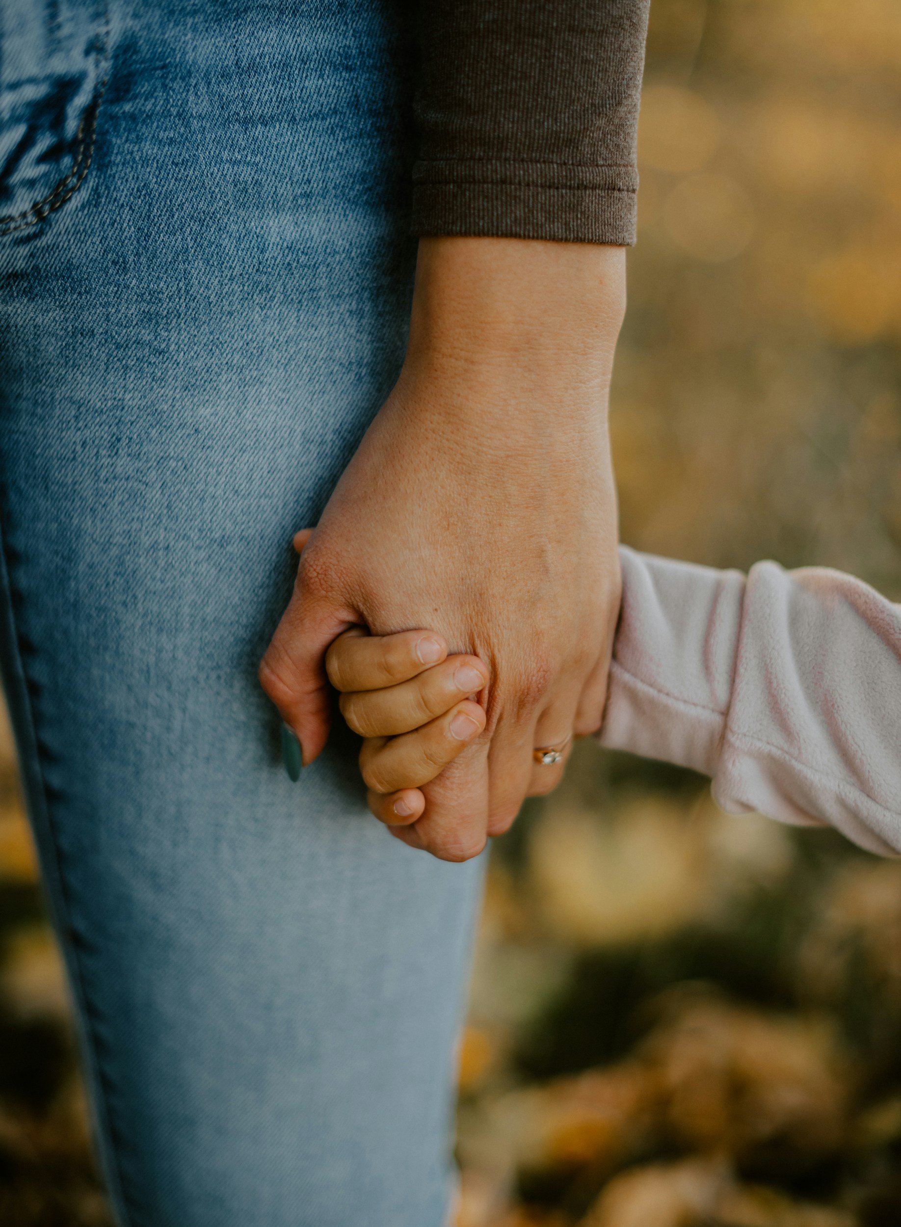 Parent and child holding hands