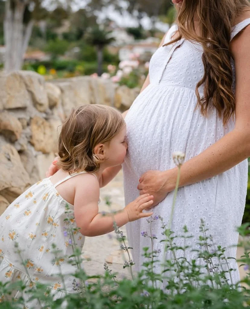 Pregnant mother with young child
