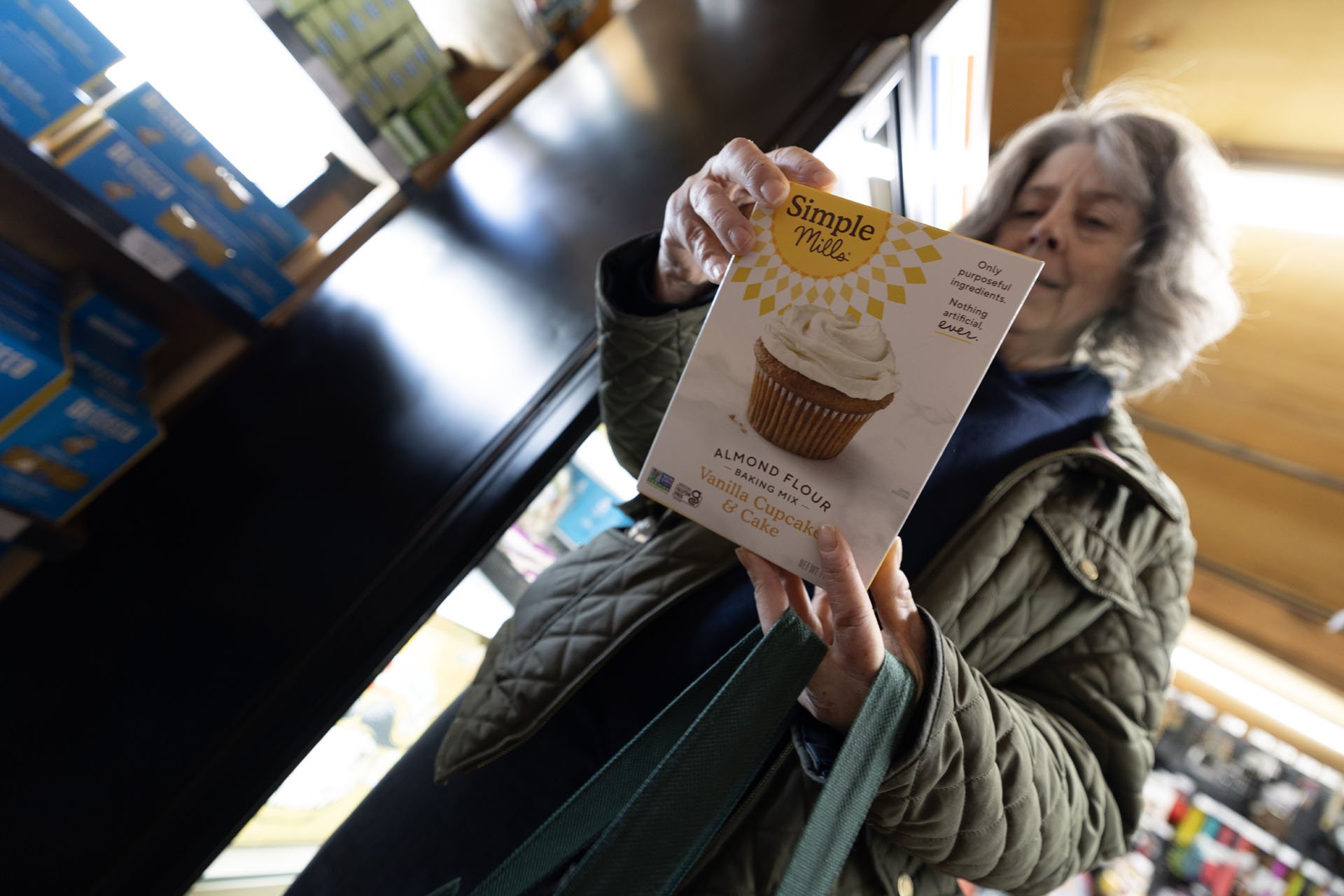 woman looking at gluten free cupcake box