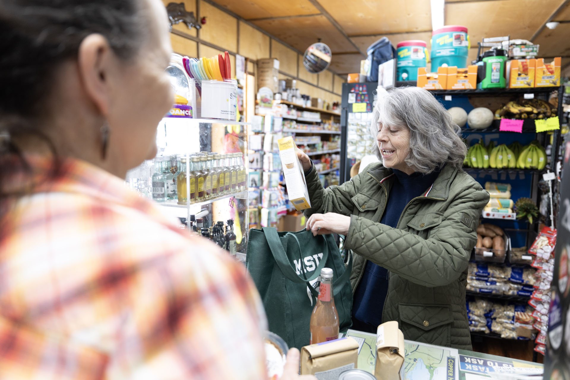 woman checking out at copper harbor mi grocery store