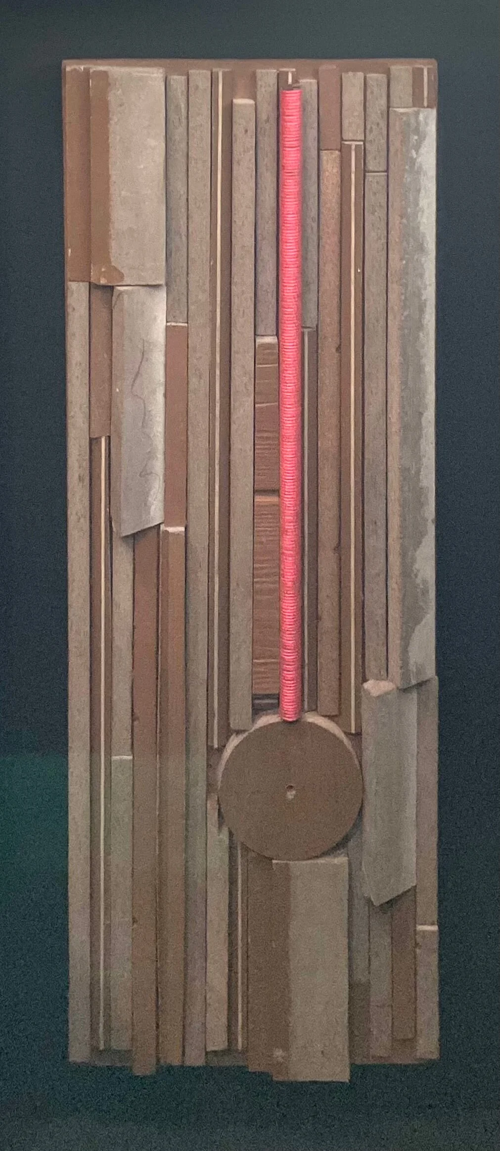  The Pendulum  
Salvaged Nichiha house siding, mason string line, rebar, on salvaged plywood | 17.5" x 36"