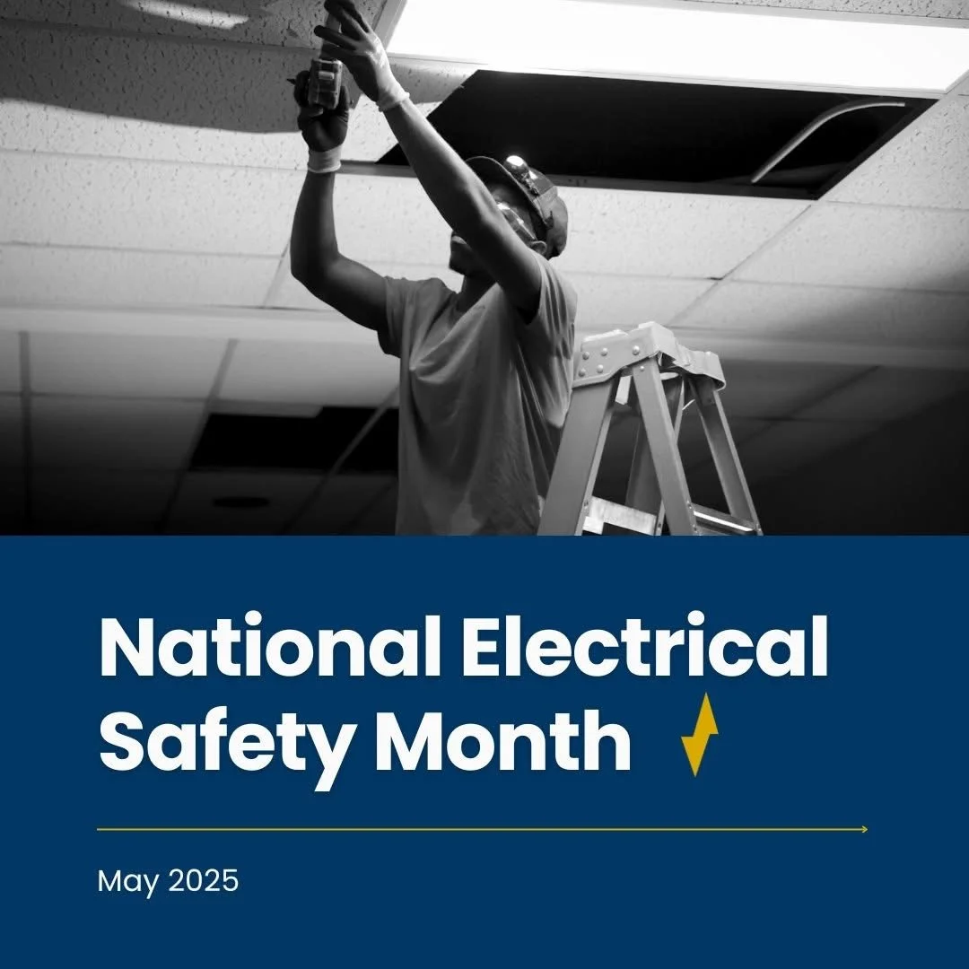 A worker on a ladder installing a ceiling panel in an office or commercial building. The image is in black and white, and there is a graphic overlay that reads 'National Electrical Safety Month, May 2025' with a lightning bolt symbol.
