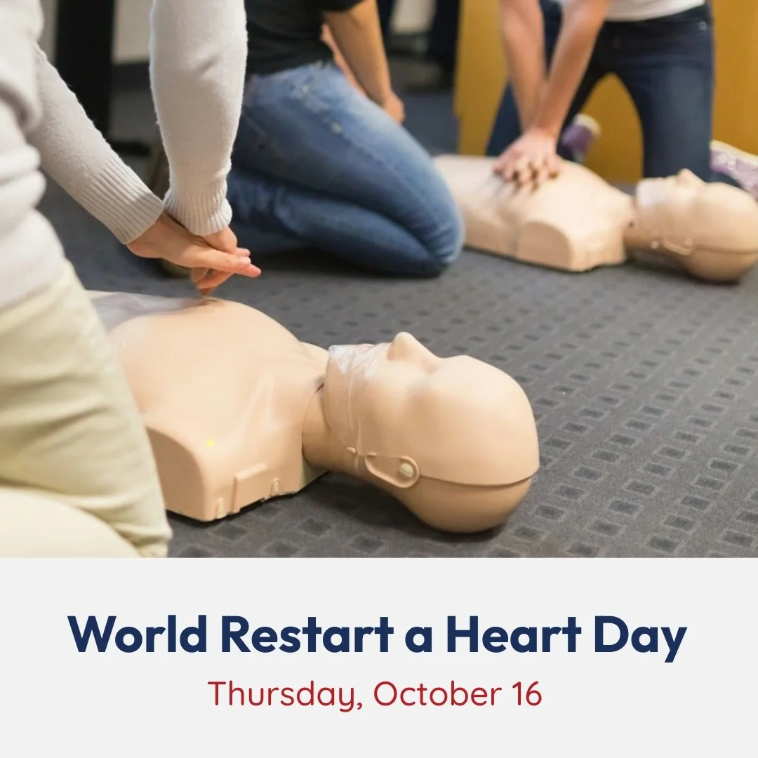 People practicing CPR on mannequins during a training session for World Restart a Heart Day.