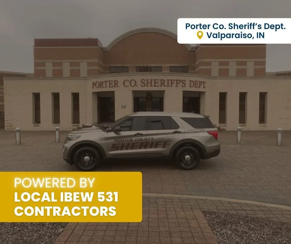 Photo of the Porter County Sheriff's Department building in Valparaiso, Indiana, with a sheriff's SUV parked in front. The building has the sign "PORTER CO. SHERIFF'S DEPT" on it, and a label on the image mentions it is powered by Local IBEW 531 cont