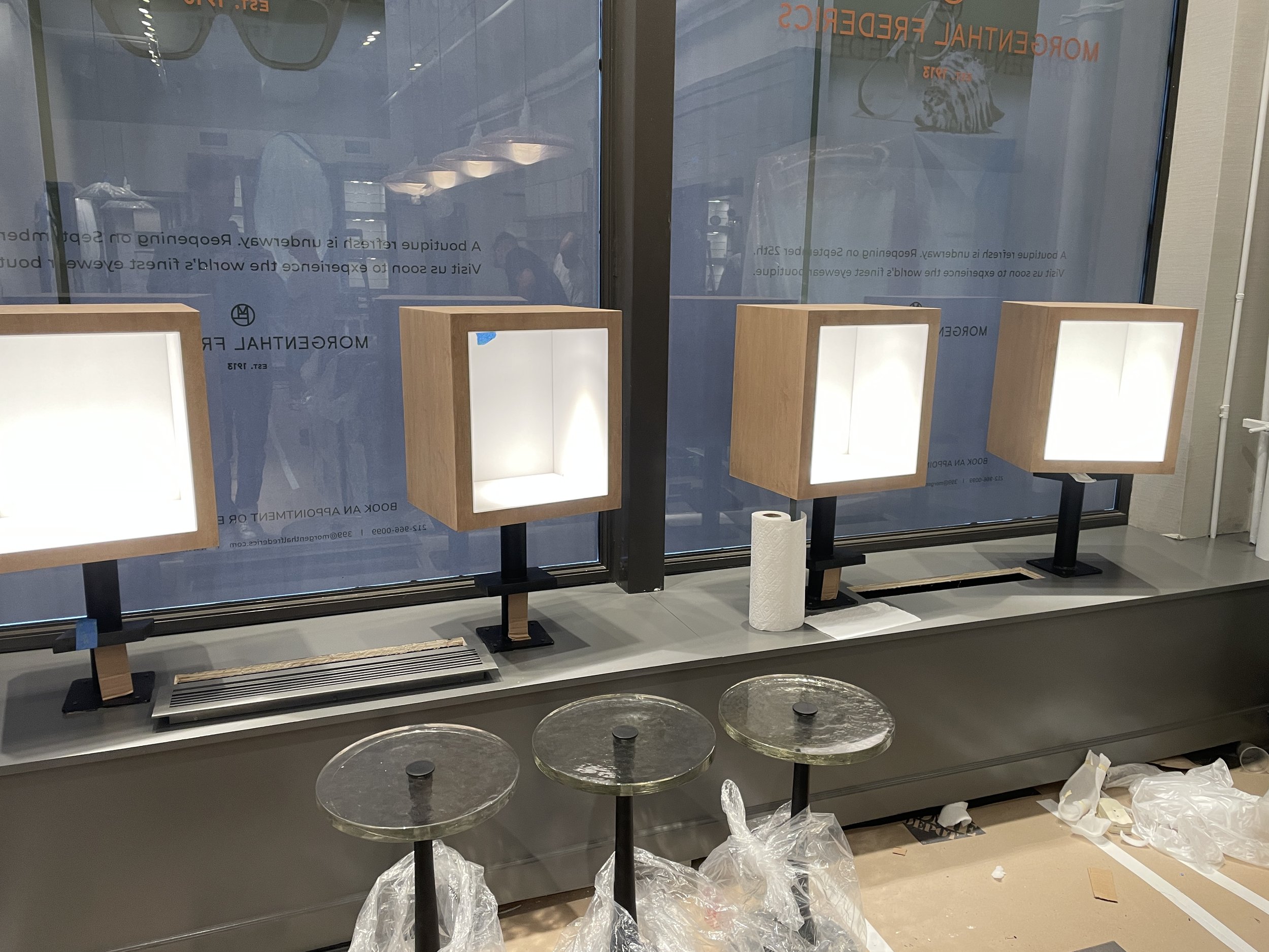 Rotating light up display boxes for eyeware.