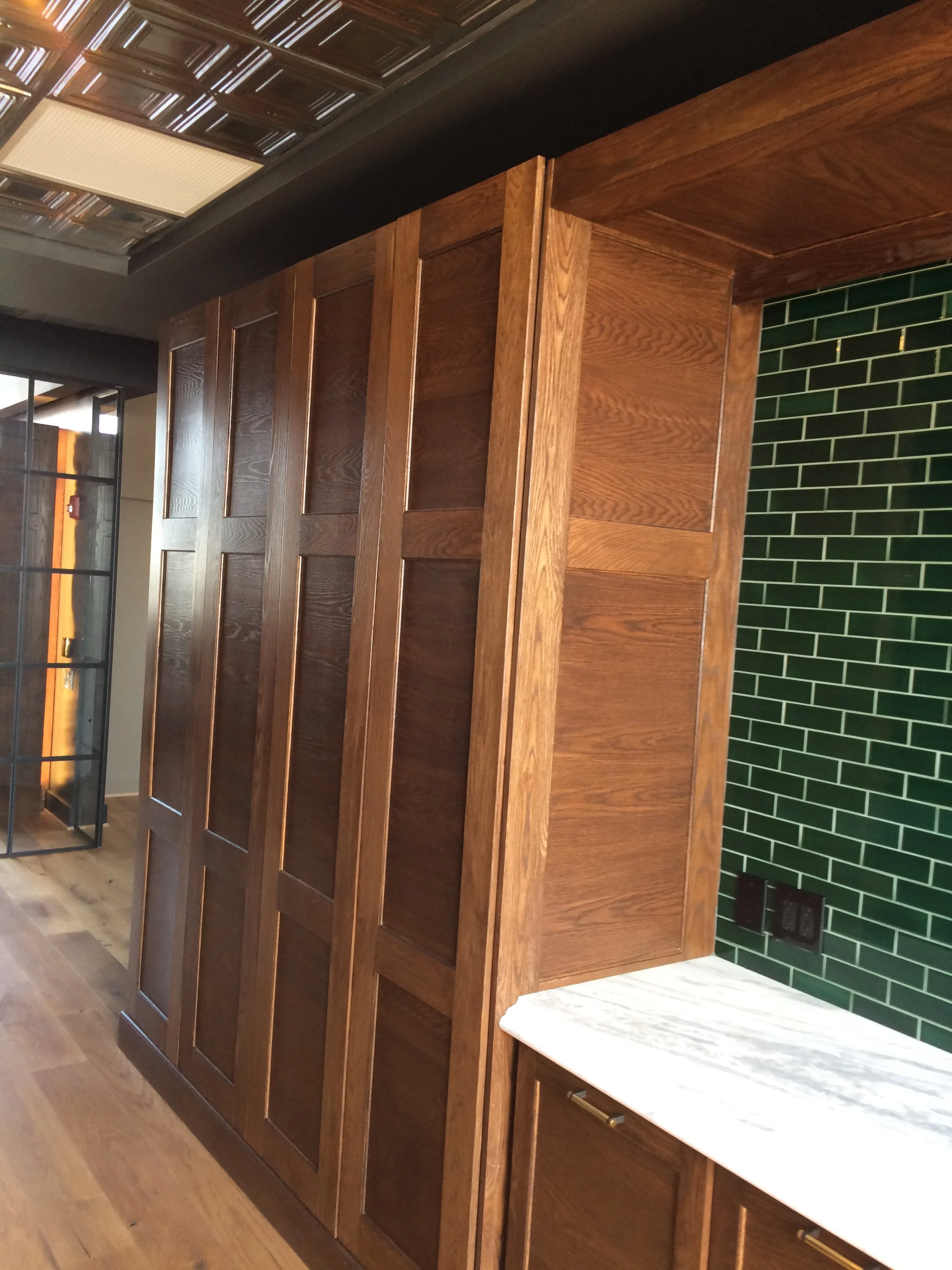 Floor to ceiling stained Oak Cabinets at PCM