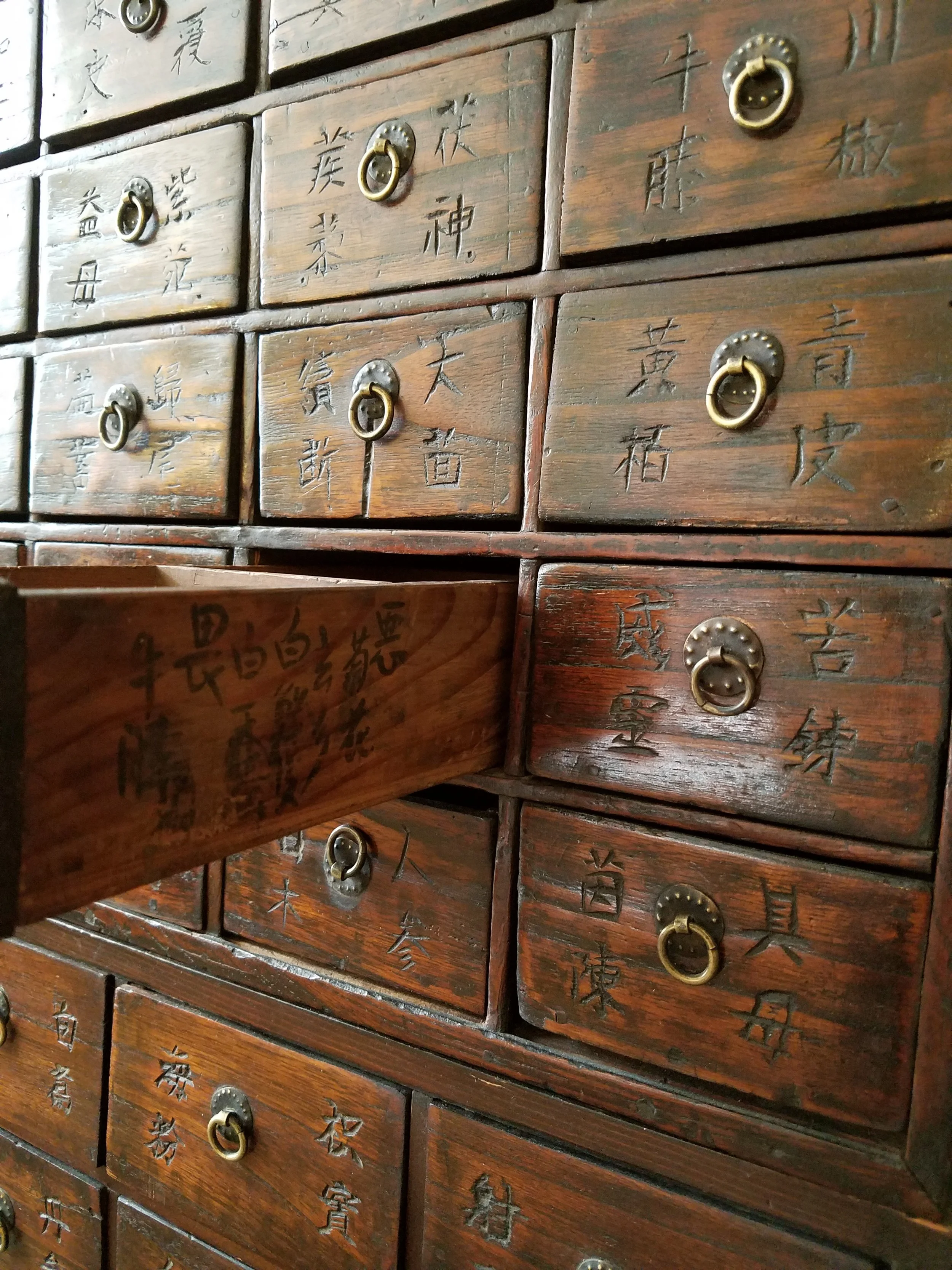 Traditional Chinese herbal medicine cabinet at Clinic Eight in Iowa City