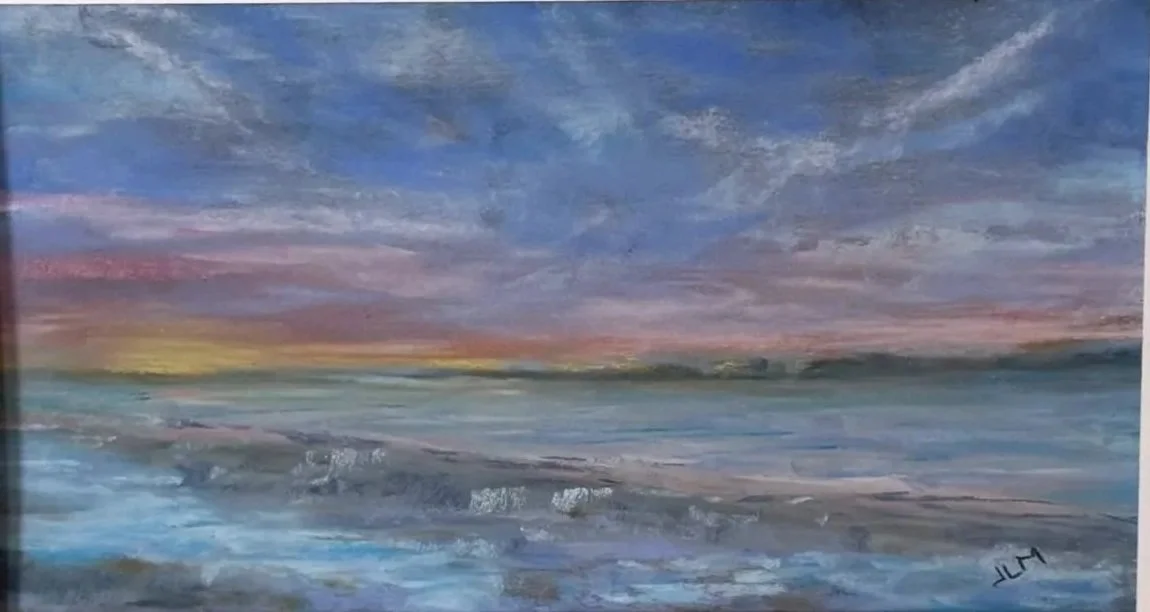 A watercolor painting of a sunset over the ocean with clouds, waves, and a distant shoreline.