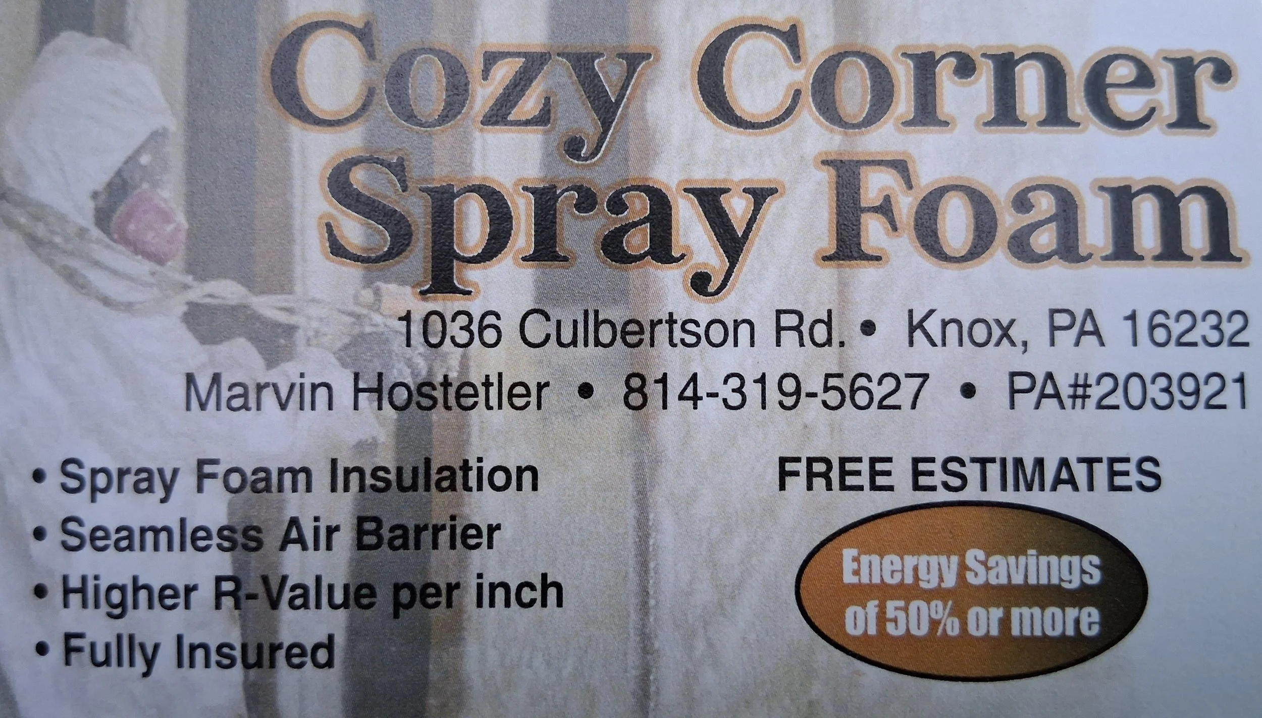 A business card for Cozy Corner Spray Foam. It includes contact information, such as address at 1036 Culbertson Rd., Knoxville, PA 16232, Marvin Hostetler, phone number 814-319-5627, and PA#203921. The card highlights services like spray foam insulation, seamless air barriers, higher R-value per inch, and full insurance, with free estimates and energy savings of 50% or more.